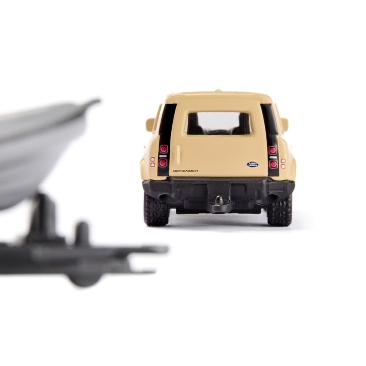 SIKU Blister 1126 - Land Rover Defender Safari s člunem
