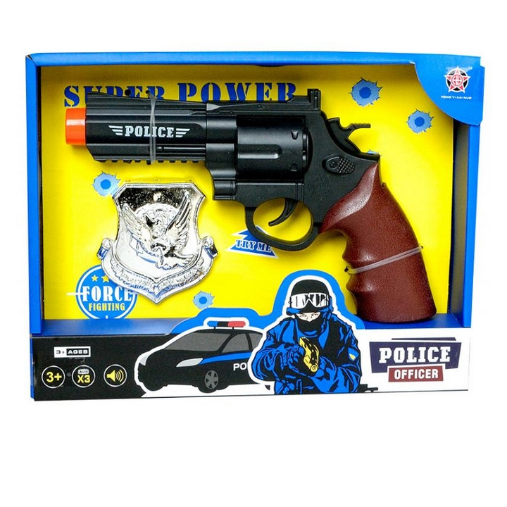 Policejní pistole s odznakem
